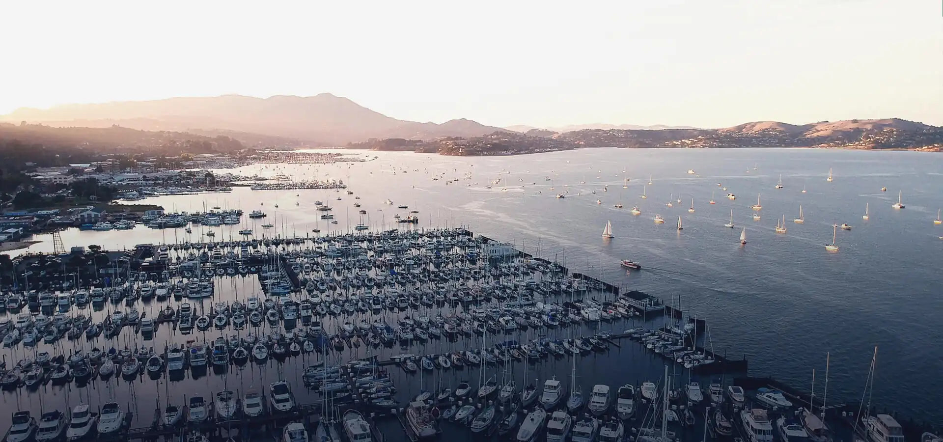 marina with yachts at sunset